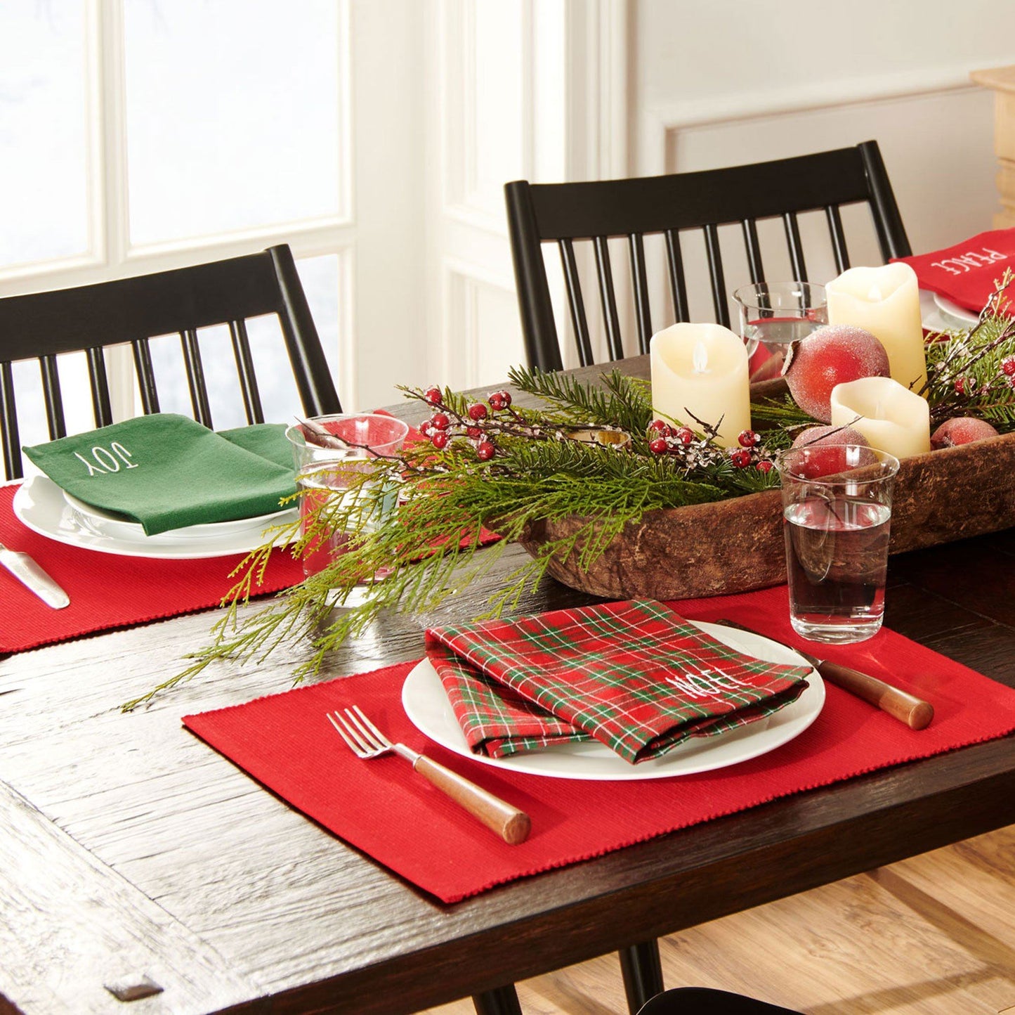 4 red placemats and coordinating mix-matched napkins. Each napkin is different. The green one says "joy" , the red one says "peace", the red/green plaid 1 says "noel", the red/green plaid 2 says "Merry"