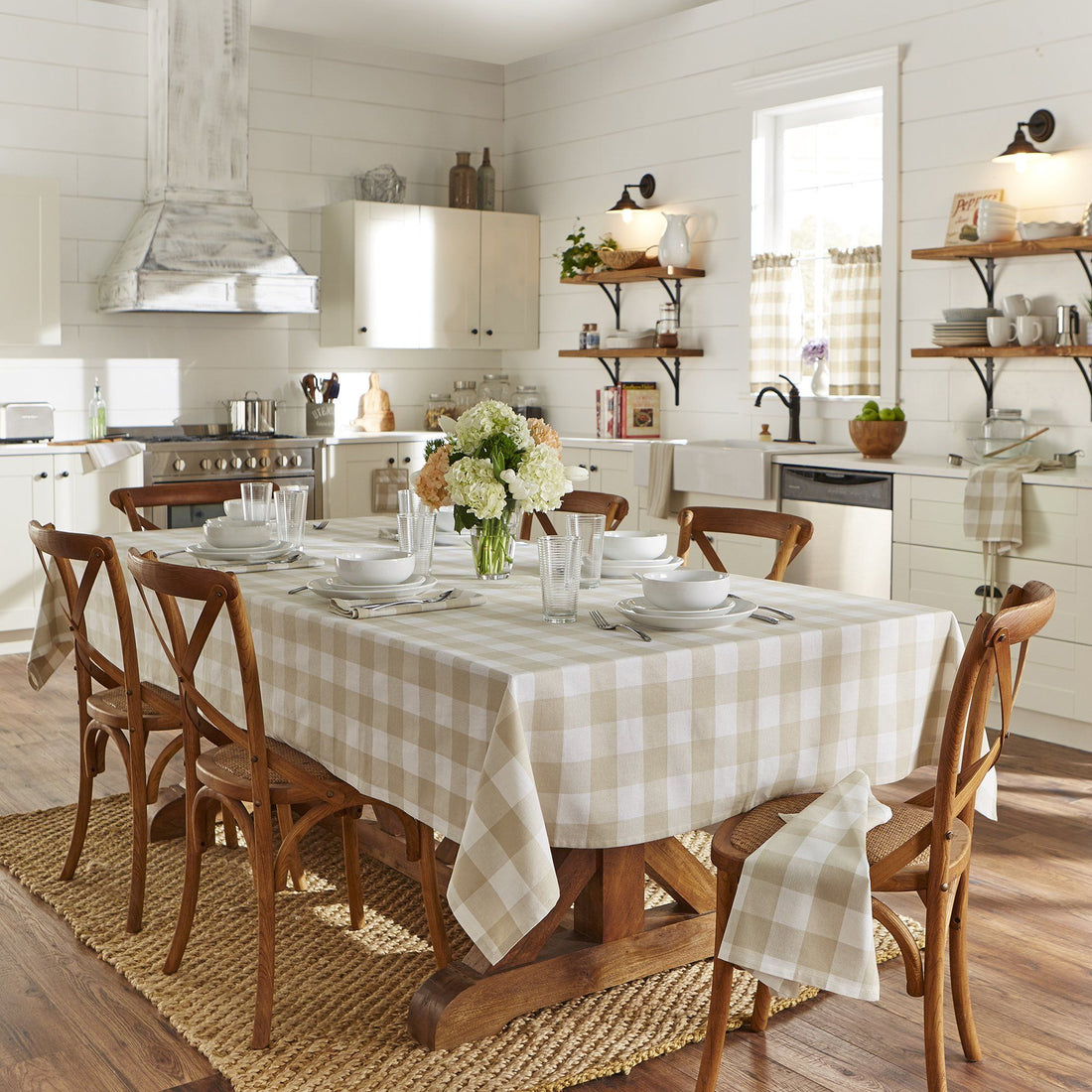 Farmhouse style kitchen with neutral buffalo check pattern tablecloth and accents
