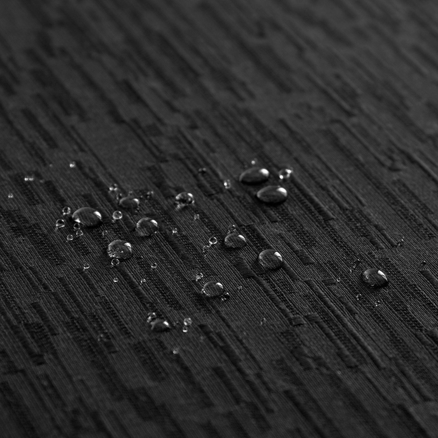 Mantel continental resistente al agua y a las manchas de textura sólida