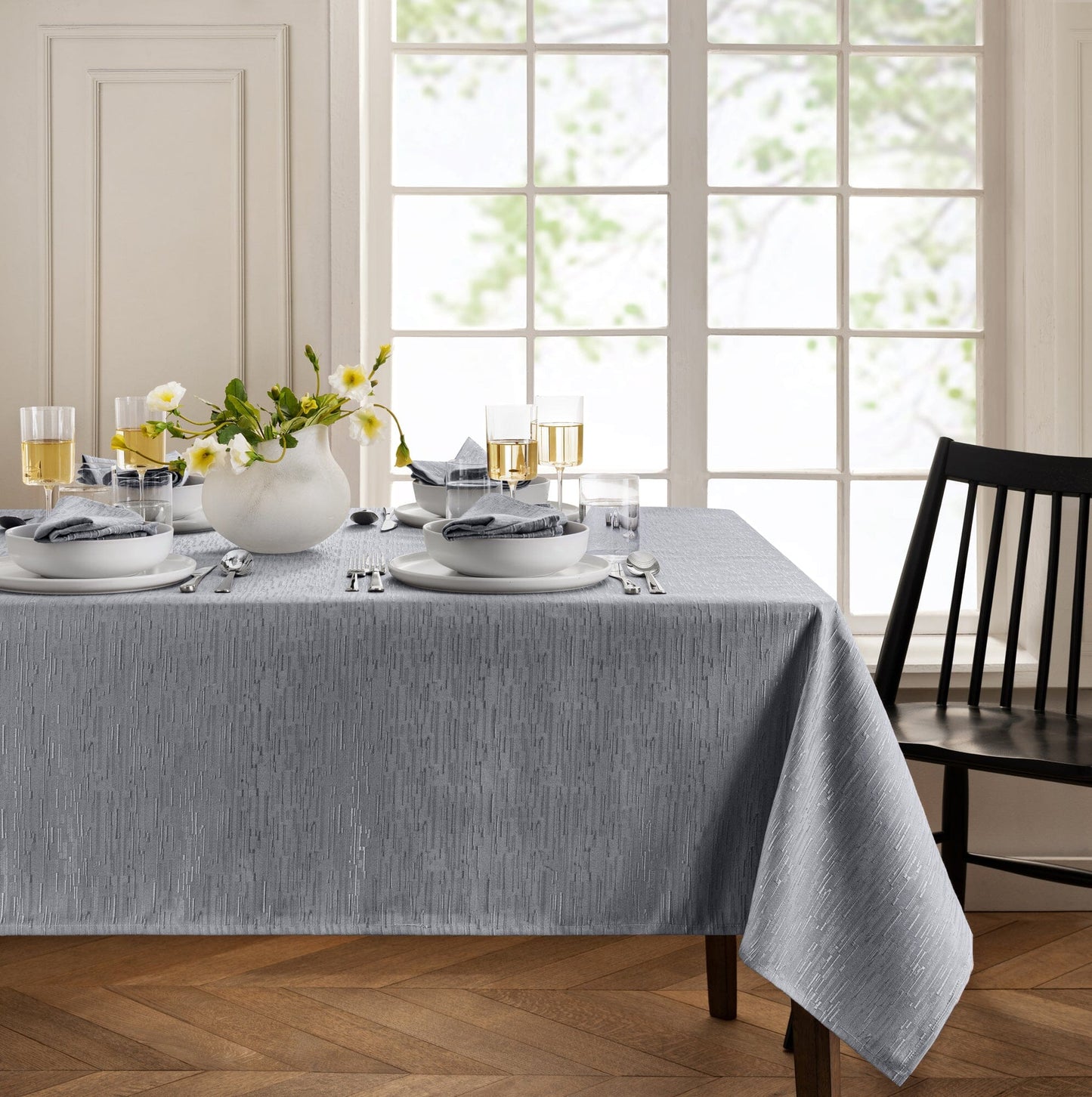Mantel continental resistente al agua y a las manchas de textura sólida