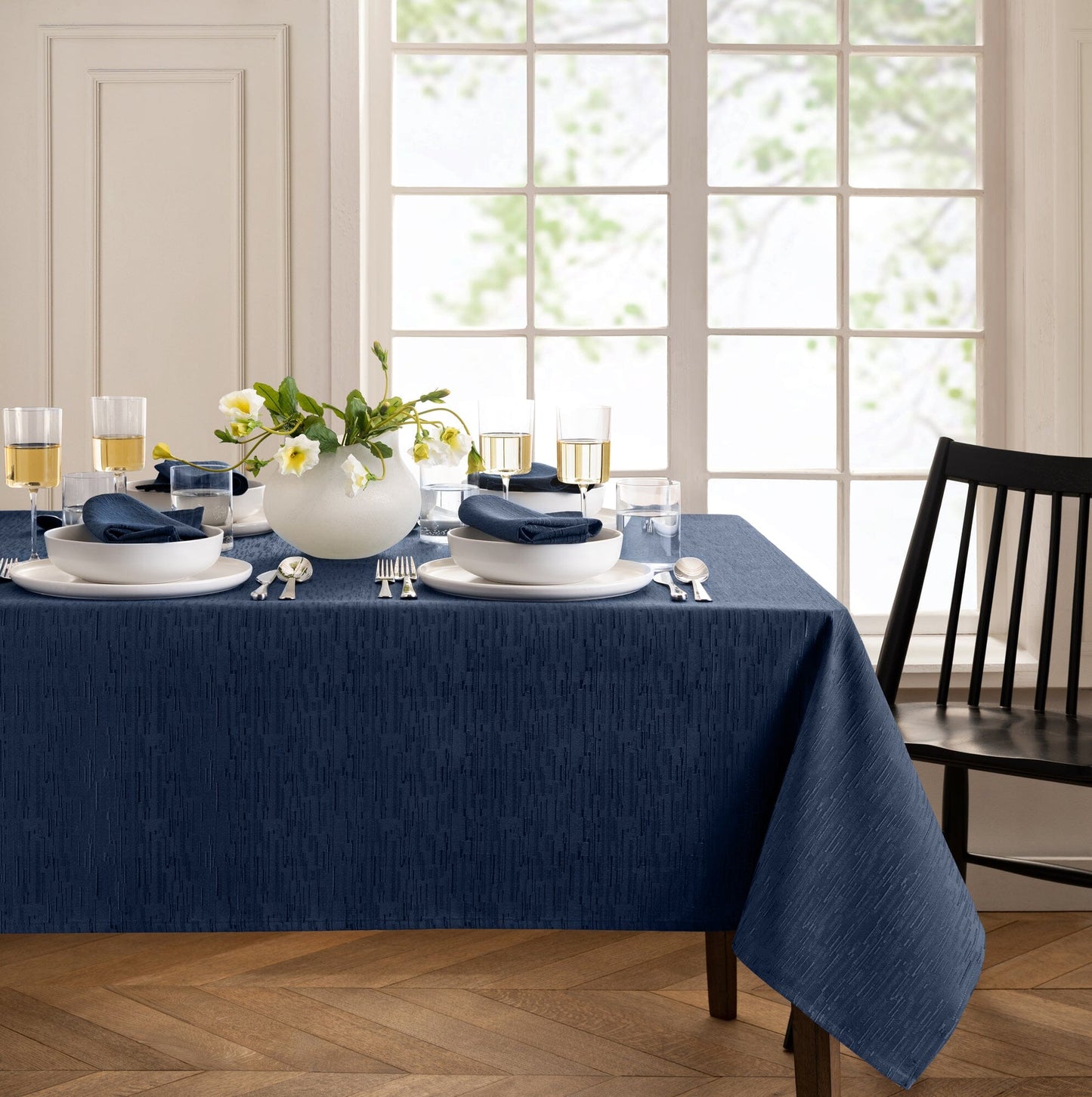 Mantel continental resistente al agua y a las manchas de textura sólida