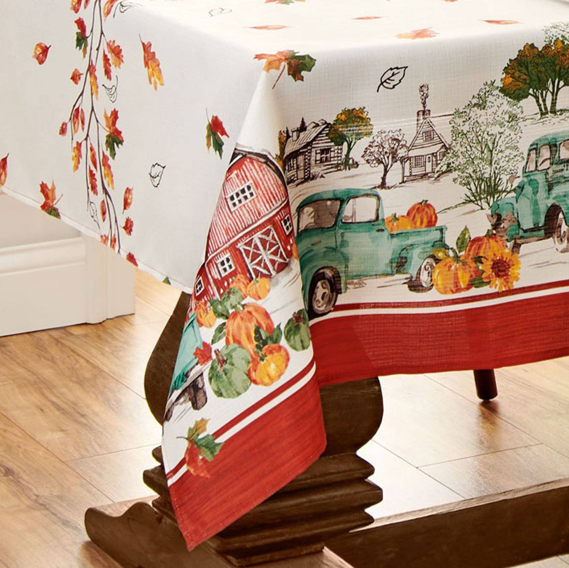 Blue farm truck, red barn and pumpkin boarder tablecloth with fall leaves center design