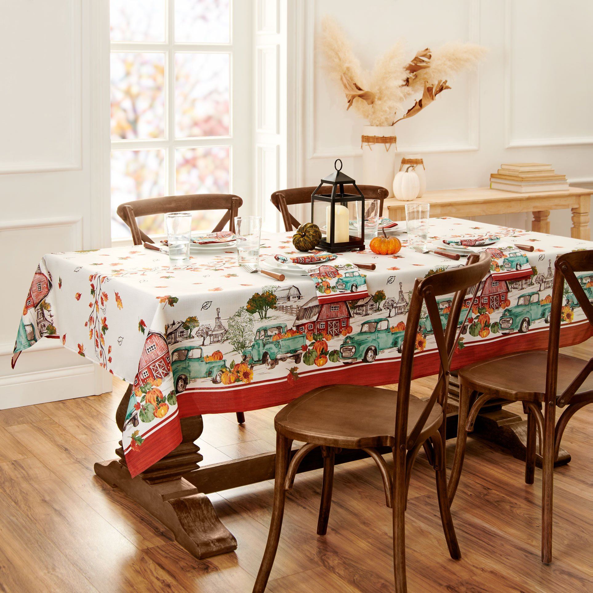 Blue farm truck, red barn and pumpkin boarder tablecloth with fall leaves center design