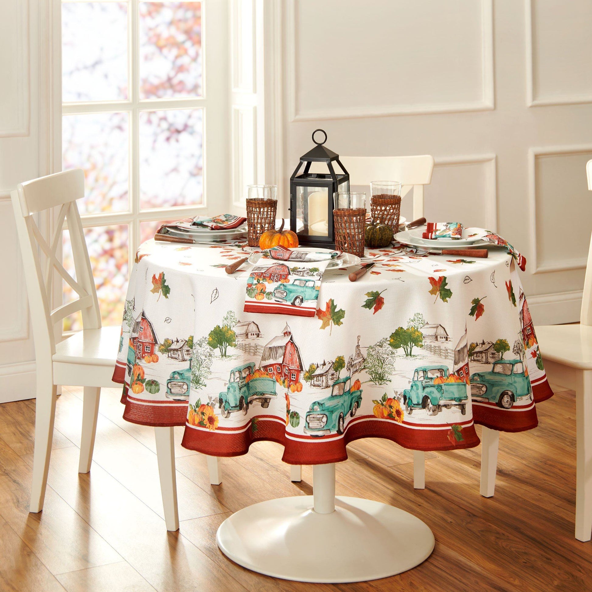 Blue farm truck, red barn and pumpkin boarder tablecloth with fall leaves center design