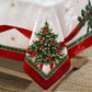 White holiday tablecloth with holly damask designs all over, red ribbon design border and red and green holly and Christmas trees along the ribbon border corner shot