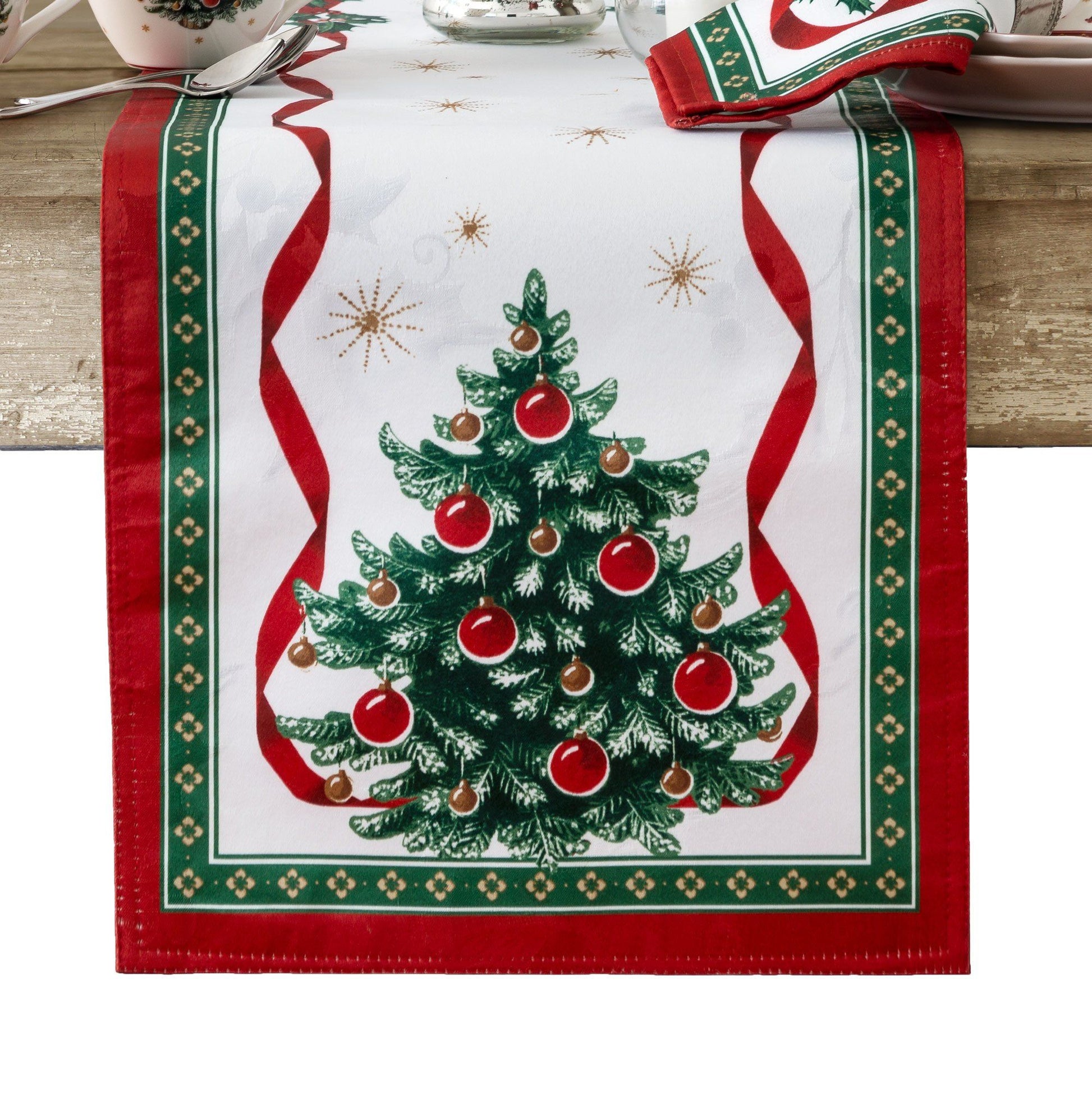 White holly damask runner with a Christmas tree design on each end. Entire runner is bordered in red/green and red ribbon design with holly sprigs.